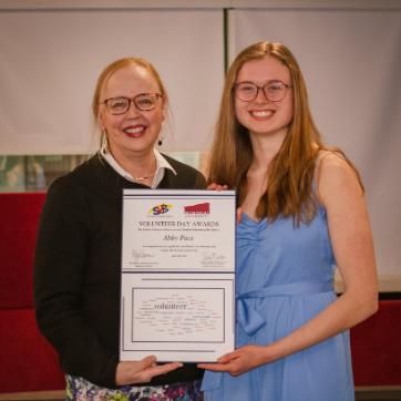 Pictured from left, Dr. Donna Hardy Cox presents Abby Pace with the Volunteer of the Year 2023 award.